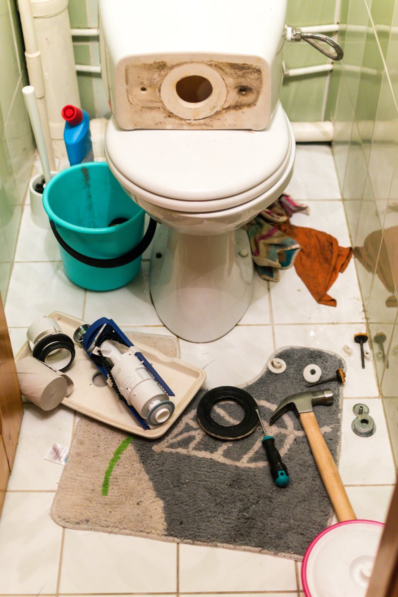 New toilet being installed in a Thamesmead bathroom